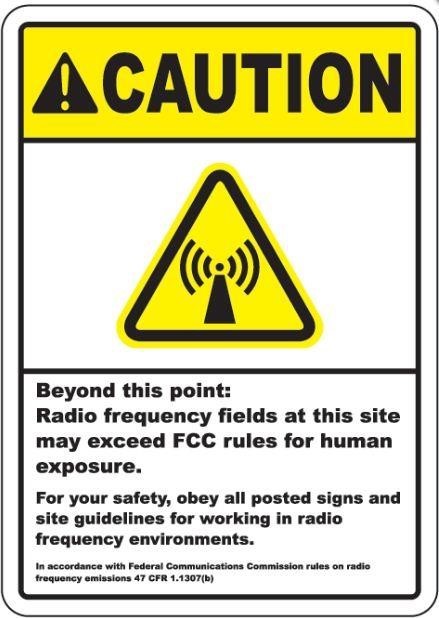 yellow and white sign saying Caution beyond this point radio frequency fields at this site may exceed FCC rules for human exposure